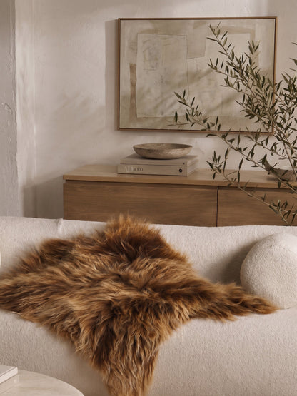 Brown Icelandic sheepskin laid on a bench
