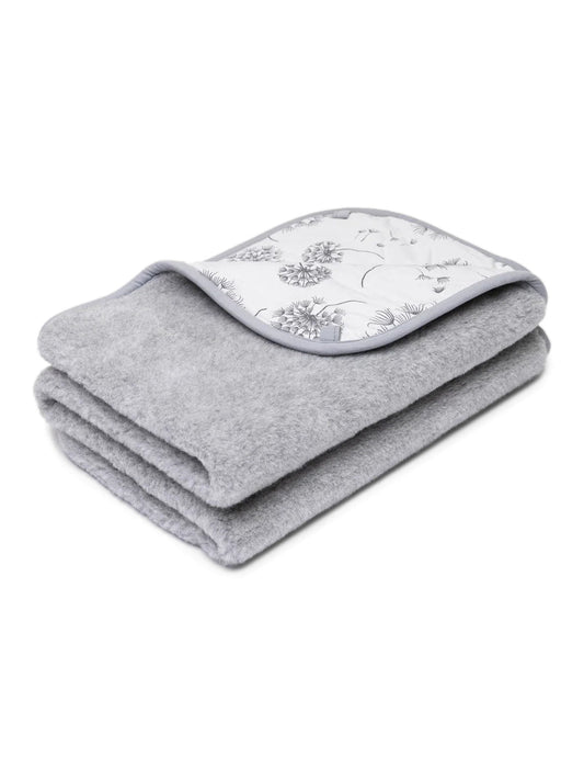 Children's merino blanket Dandelion, 2-ply, folded, with its dandelion-print cotton side