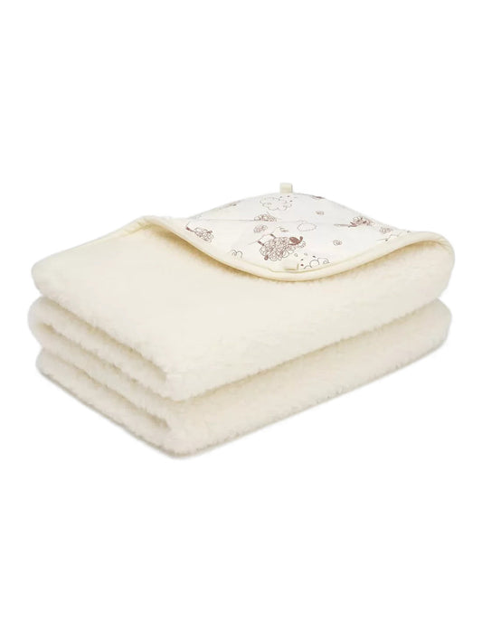 Children's merino blanket Hazelnut, 2-ply, folded, with its sheep-print cotton side