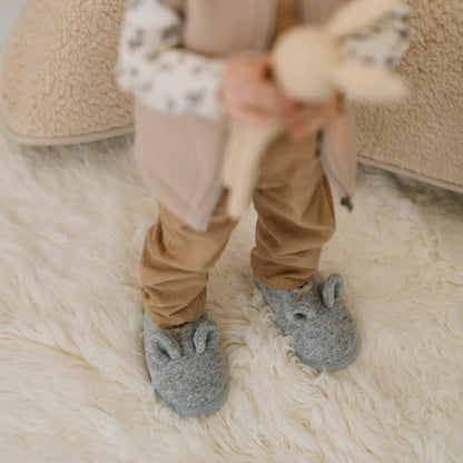 Close-up of a child's feet in Mouse merino slippers
