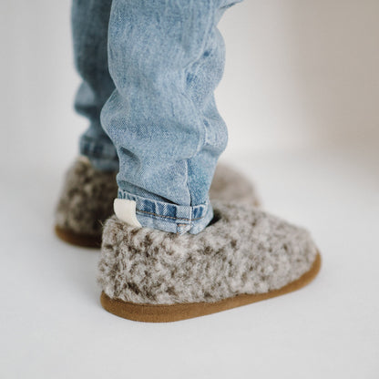 Tiger merino slippers worn with jeans, from the side