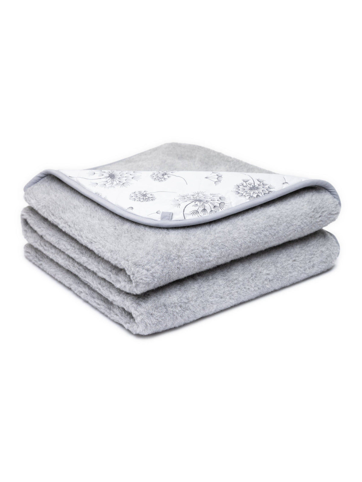 Merino blanket Dandelion, 2-ply, folded, with its dandelion-print cotton side