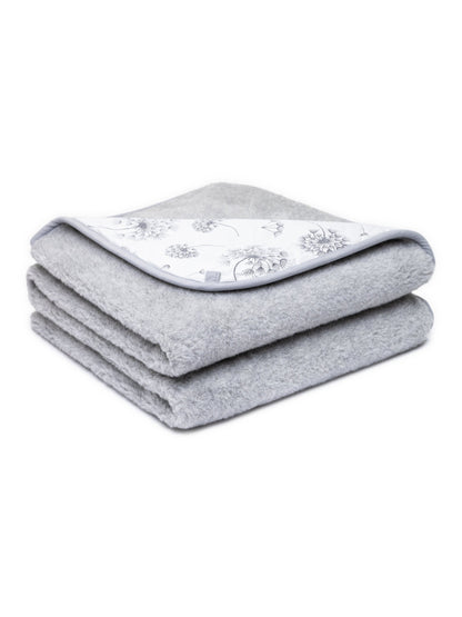 Merino blanket Dandelion, 2-ply, folded, with its dandelion-print cotton side