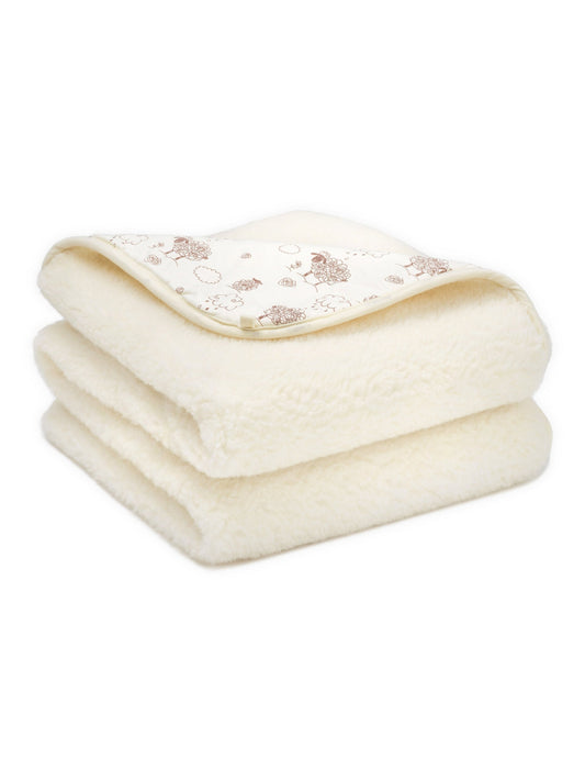 Merino blanket Hazelnut, 2-ply, folded, with its sheep-print cotton side