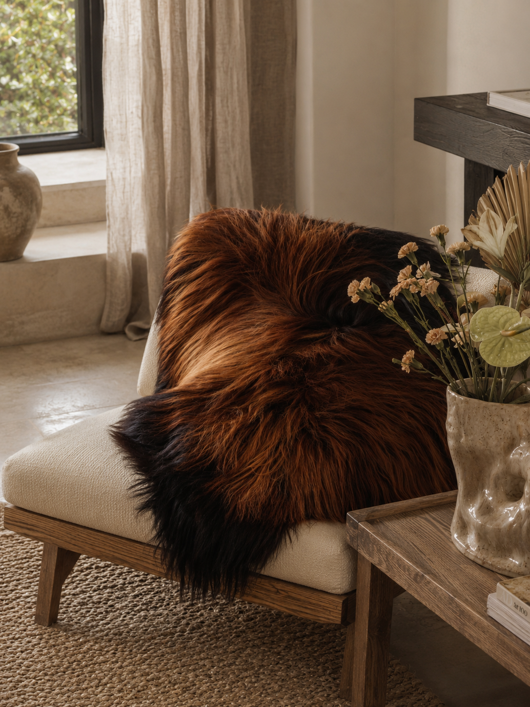 Icelandic Rusty sheepskin over a wooden armchair by the window
